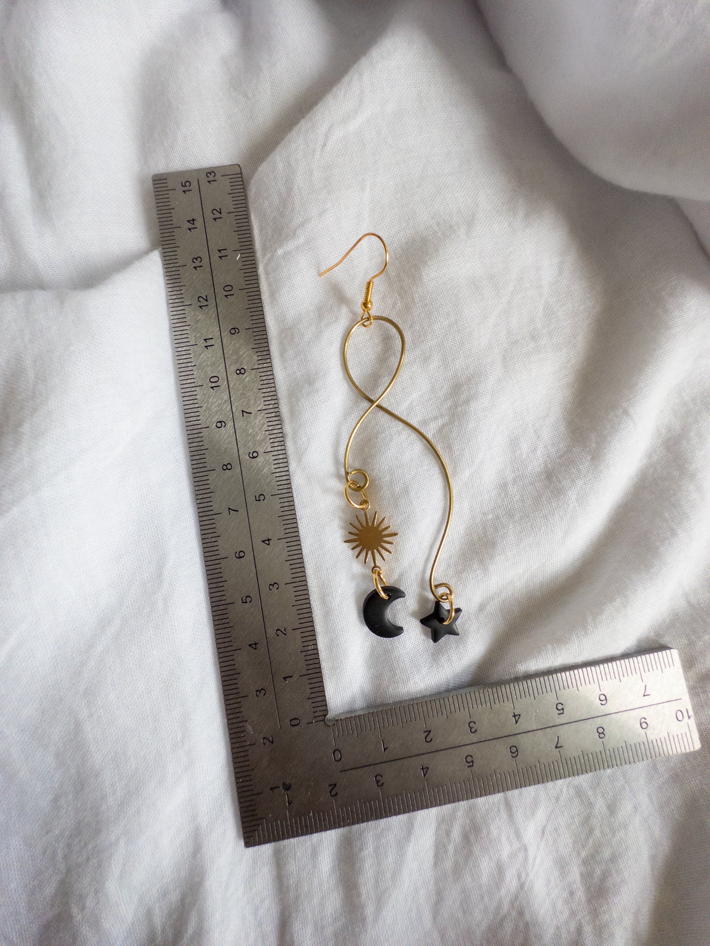 Celestial wire dangles Black