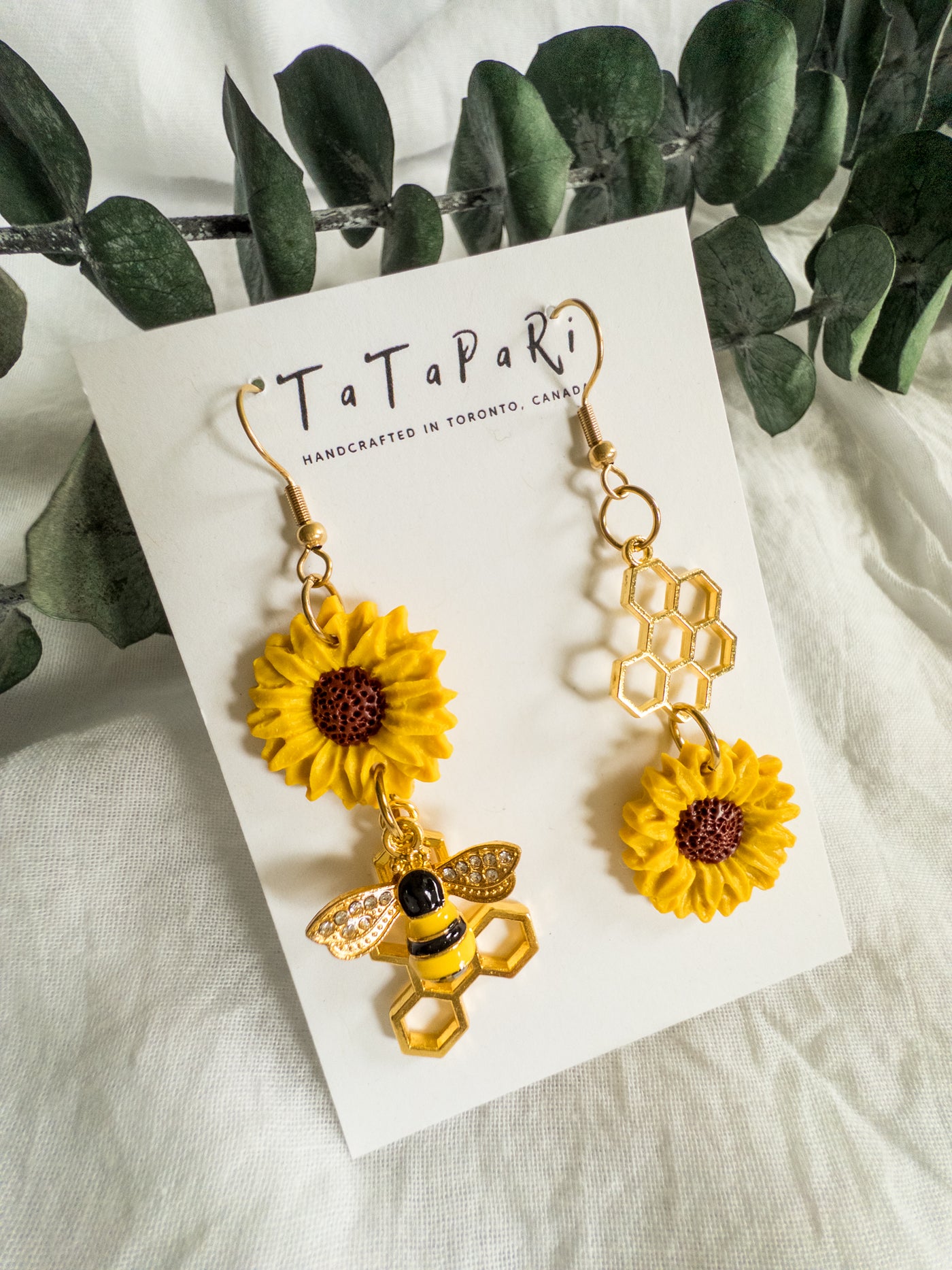 Asymmetrical sunflowers and bees
