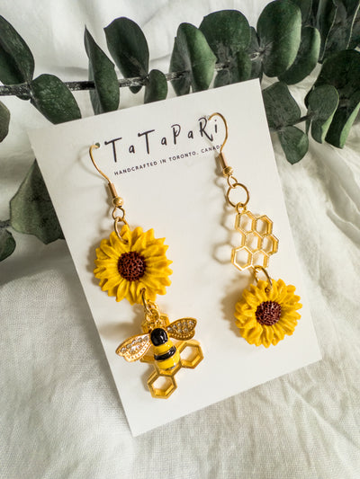Asymmetrical sunflowers and bees